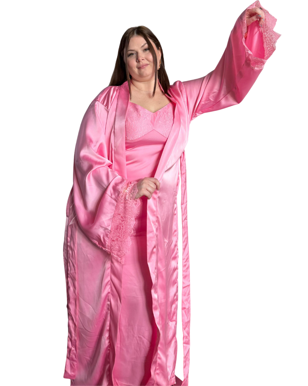 Woman wearing a pink satin intentional soft mom robe with lace trim